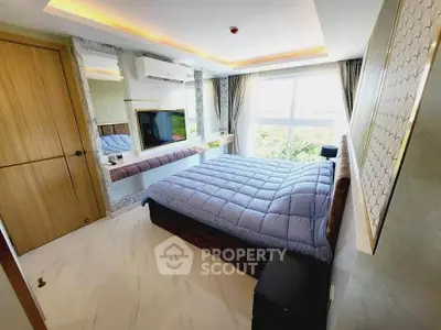 Luxurious bedroom with modern decor and large window offering stunning views.