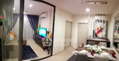 Modern open-plan living and dining area with stylish decor and natural light.