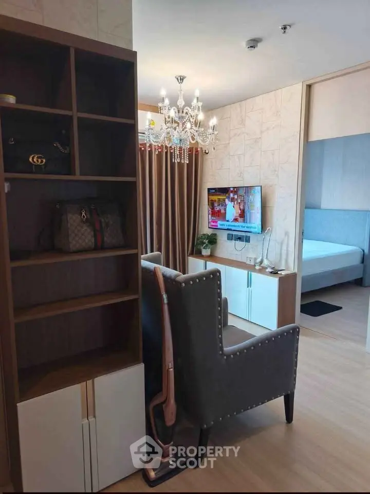 Modern living room with elegant chandelier and stylish decor