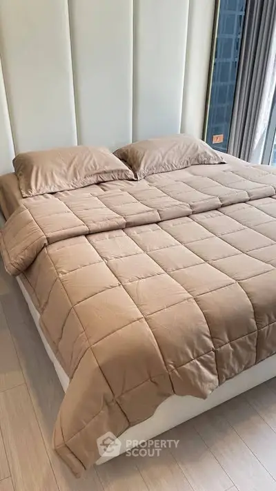 Luxurious bedroom with plush bedding and modern design