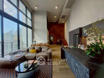 Luxurious modern living room with high ceilings and city view, featuring elegant decor and spacious layout.
