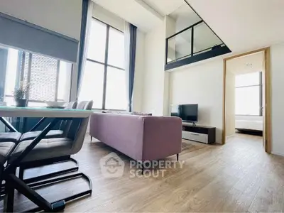 Modern living room with high ceilings and mezzanine in stylish apartment