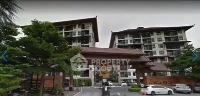 Elegant residential building with traditional architectural design and lush greenery.