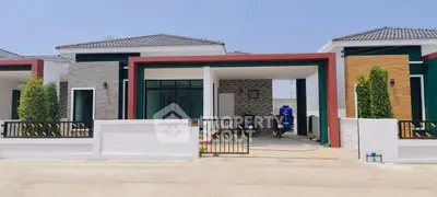 Modern single-story house with stylish facade and spacious driveway