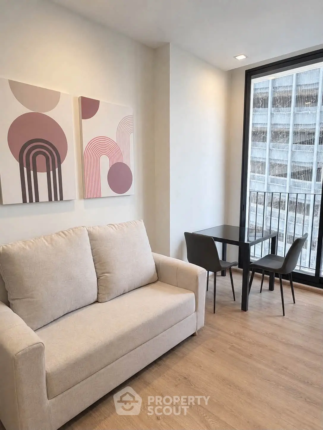 Modern living room with cozy sofa and stylish decor in a high-rise apartment
