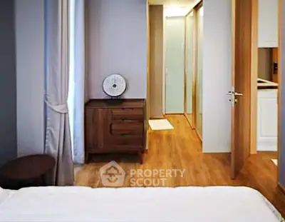 Modern bedroom with wooden flooring and elegant decor