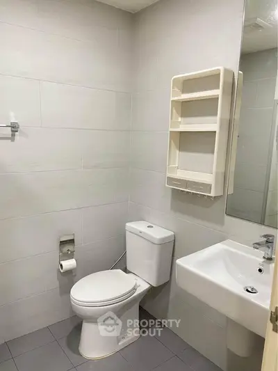 Modern minimalist bathroom with sleek fixtures and neutral tiles