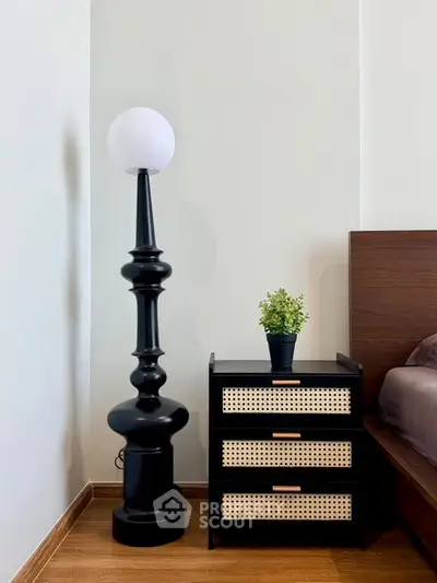 Stylish bedroom corner with modern lamp and chic nightstand