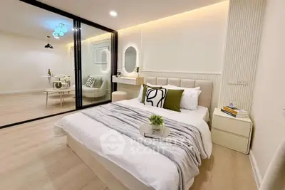 Modern bedroom with elegant decor and glass partition leading to dining area.