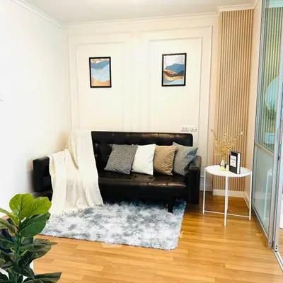 Cozy living room with stylish decor and plush rug