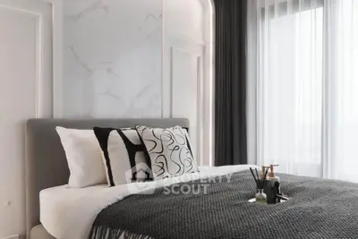 Luxurious modern bedroom with elegant decor and large windows