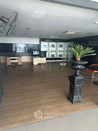 Spacious modern office lobby with wooden flooring and stylish decor