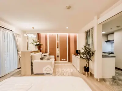 Spacious modern living room with open kitchen and elegant decor