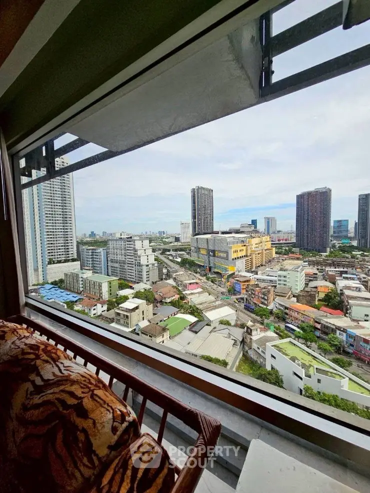 Stunning cityscape view from high-rise balcony with urban skyline