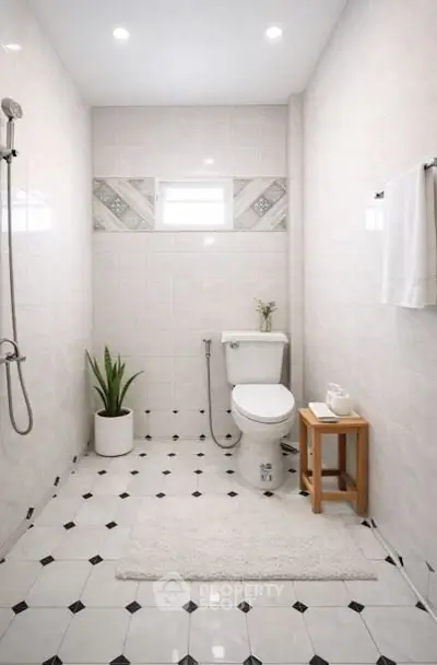 Modern minimalist bathroom with white tiles and elegant fixtures