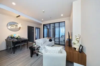 Modern living room with elegant dining area and stylish decor in a contemporary apartment.