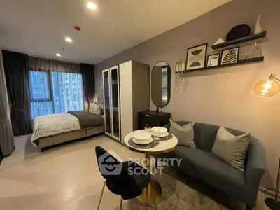 Modern studio apartment with cozy living area and stylish decor