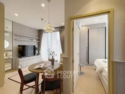 Modern open-plan living room and bedroom with stylish decor and natural light.