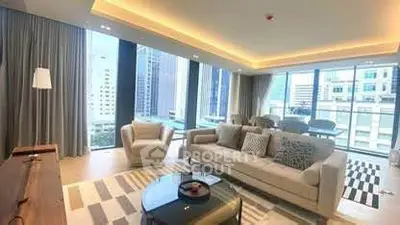Luxurious modern living room with large windows and city view