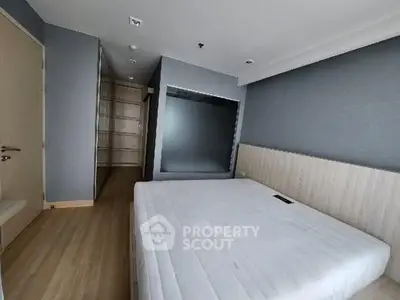 Spacious bedroom with modern design and ample storage space