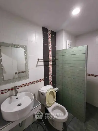 Modern bathroom with sleek fixtures and stylish tile accents