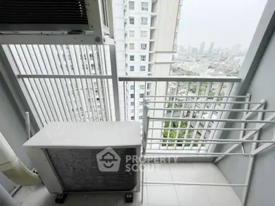 High-rise apartment balcony with city view and air conditioning unit.
