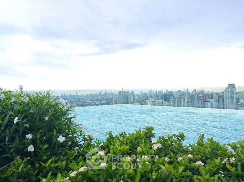 Stunning rooftop infinity pool with breathtaking city skyline view