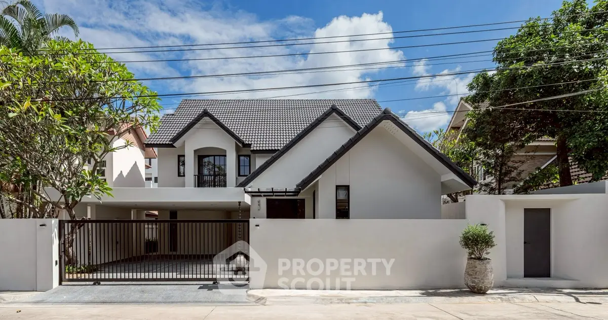 Charming modern house with sleek design and spacious driveway in a serene neighborhood.