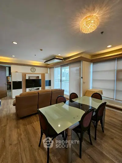Spacious modern living room with elegant dining area and stylish lighting