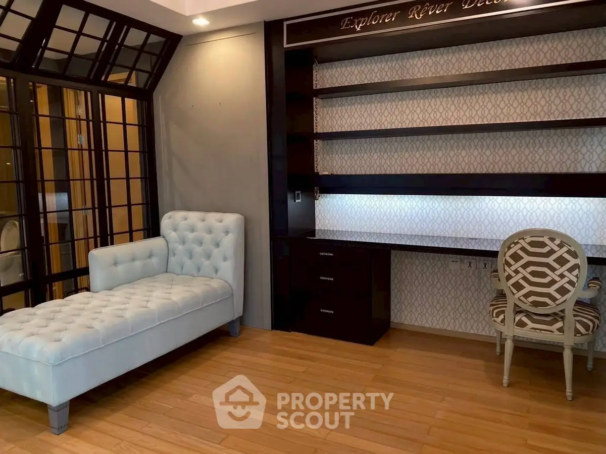 Elegant study room with chaise lounge and built-in shelving