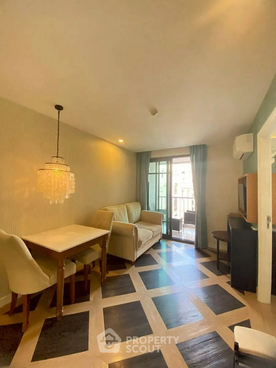 Chic living room with elegant dining area and balcony access in modern apartment.