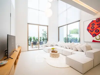 Luxurious modern living room with high ceilings and elegant decor