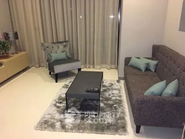 Modern living room with stylish furniture and elegant decor.