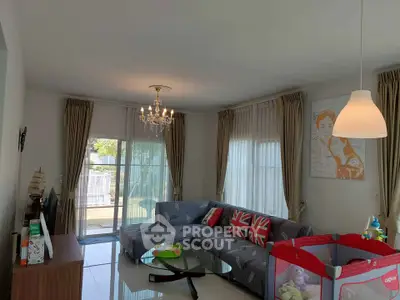 Spacious living room with modern decor and large windows for natural light.