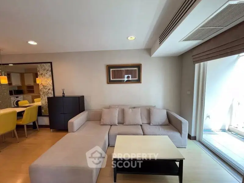 Spacious living room with modern decor and natural light