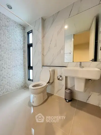 Modern bathroom with sleek design and marble accents