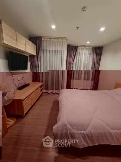 Cozy bedroom with modern furnishings and natural light