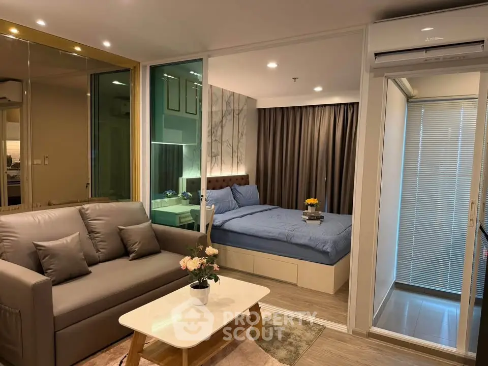 Modern studio apartment with cozy living area and stylish bedroom