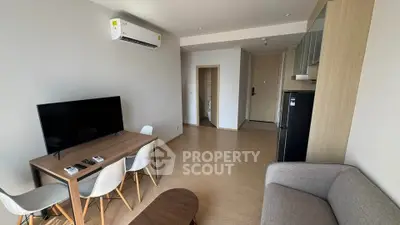 Modern living room with sleek furniture and air conditioning in a stylish apartment.