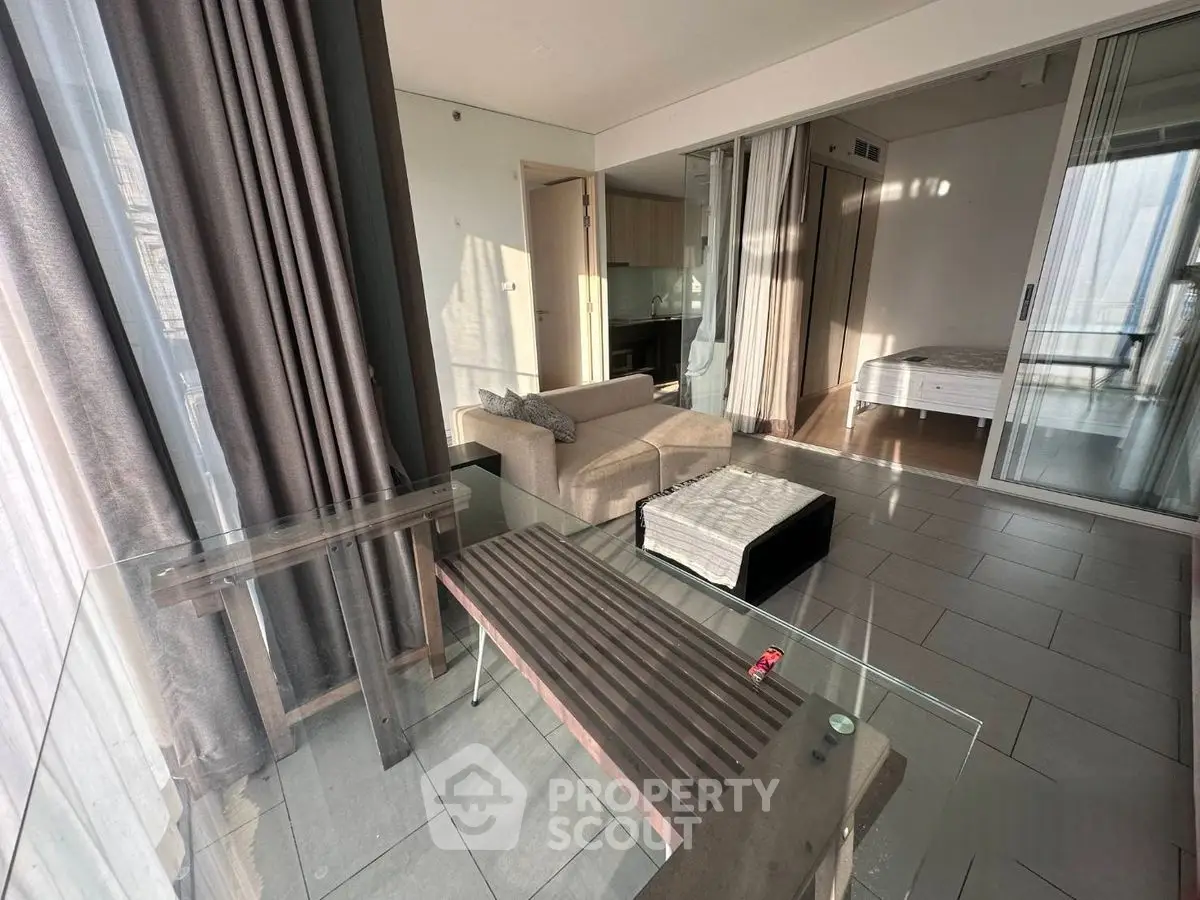 Modern apartment with glass walls and cozy furnishings