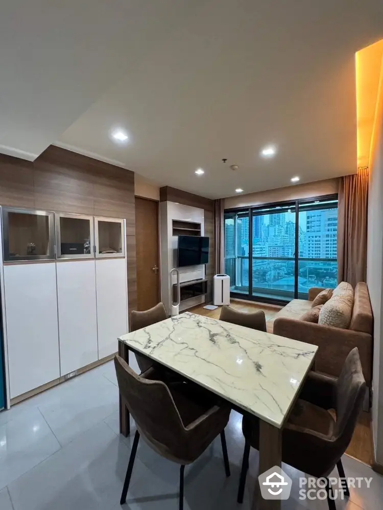 Modern living room with city view, elegant marble dining table, and cozy seating area.