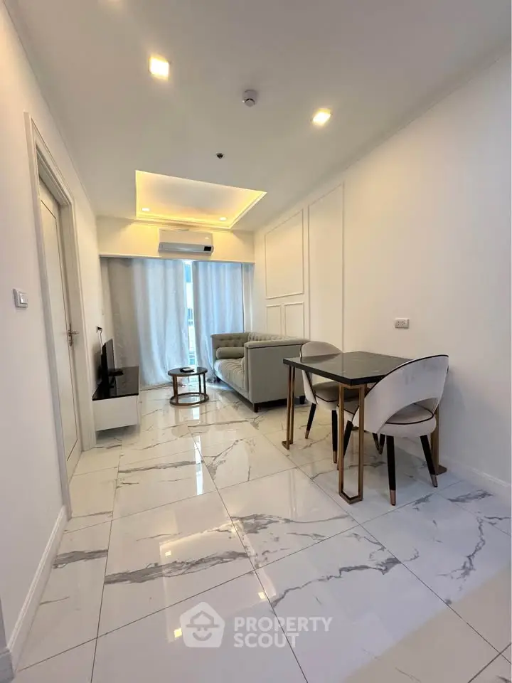 Modern living room with elegant marble flooring and stylish furniture in a bright apartment.