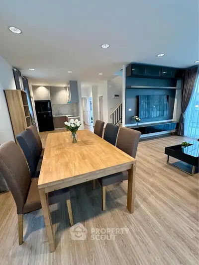 Spacious modern living room with elegant dining area and stylish decor