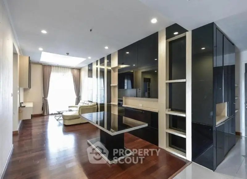 Luxurious modern living room with sleek black accents and elegant furnishings