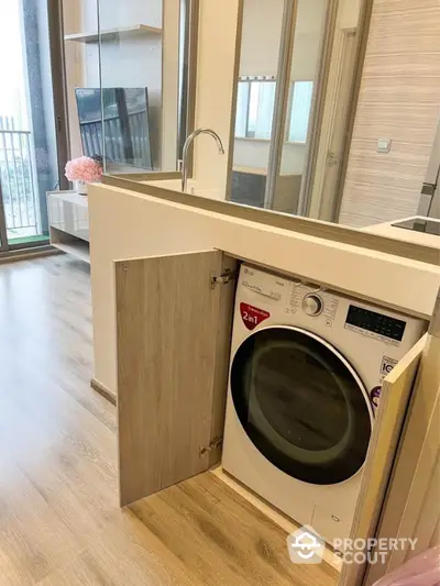 Modern apartment interior with built-in washing machine and stylish decor