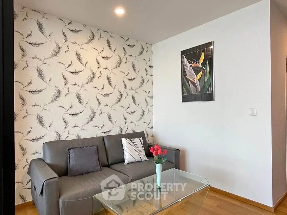 Modern living room with stylish wallpaper and sleek furniture