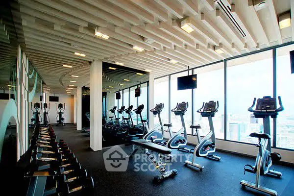 Modern gym with panoramic city views and state-of-the-art equipment.