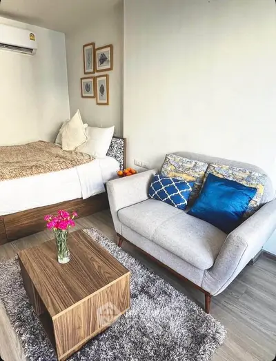 Cozy studio apartment with modern decor and comfortable furnishings