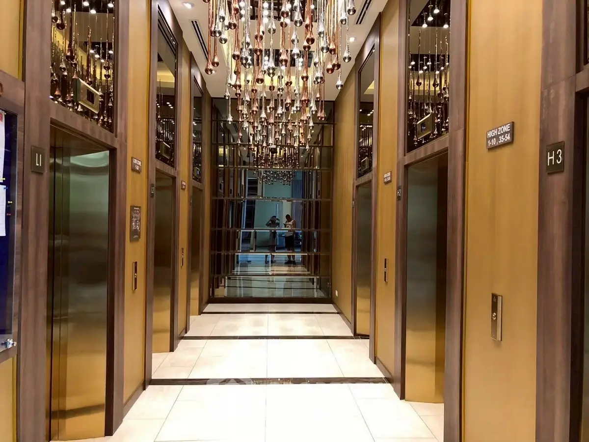 Luxurious modern elevator lobby with elegant lighting and mirrored walls.