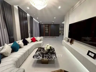 Luxurious modern living room with elegant decor and spacious seating area.